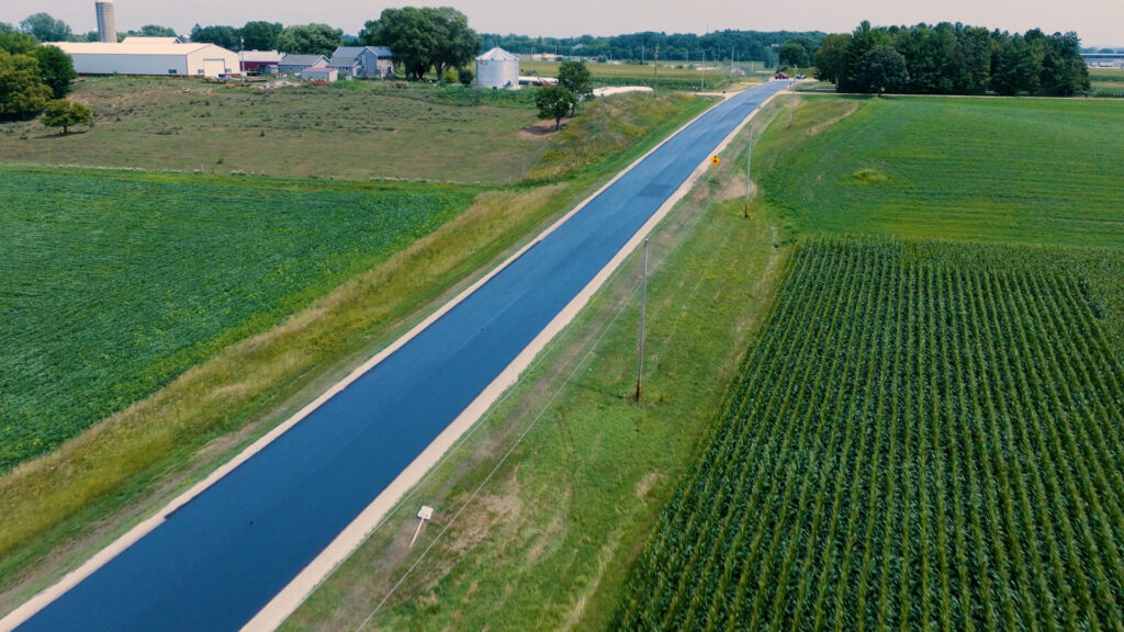 Job site photo: finished road - Rapid penetrating emulsion being applied in Dodge County Wisconsin