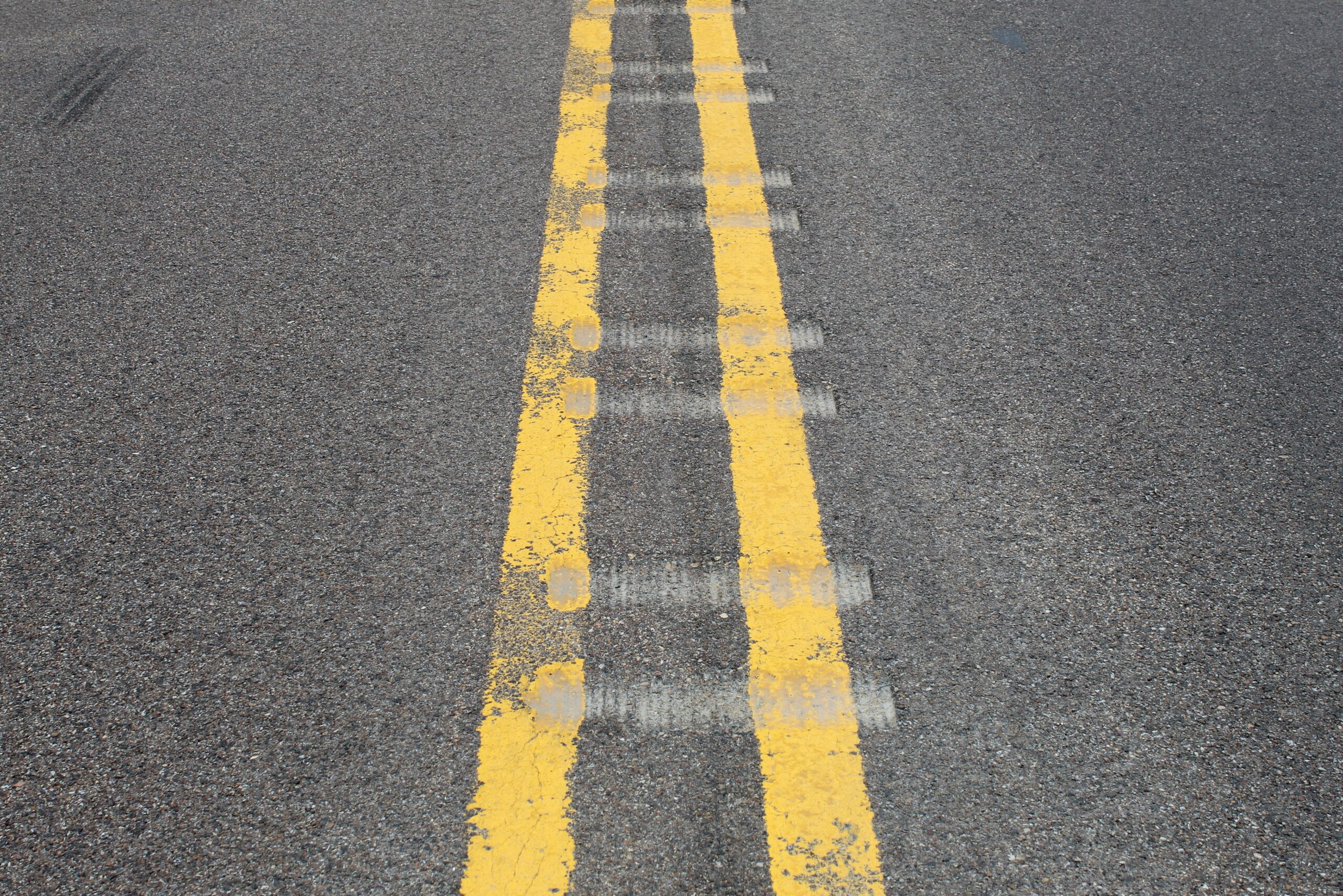 Milled centerline rumble strips on an asphalt pavement
